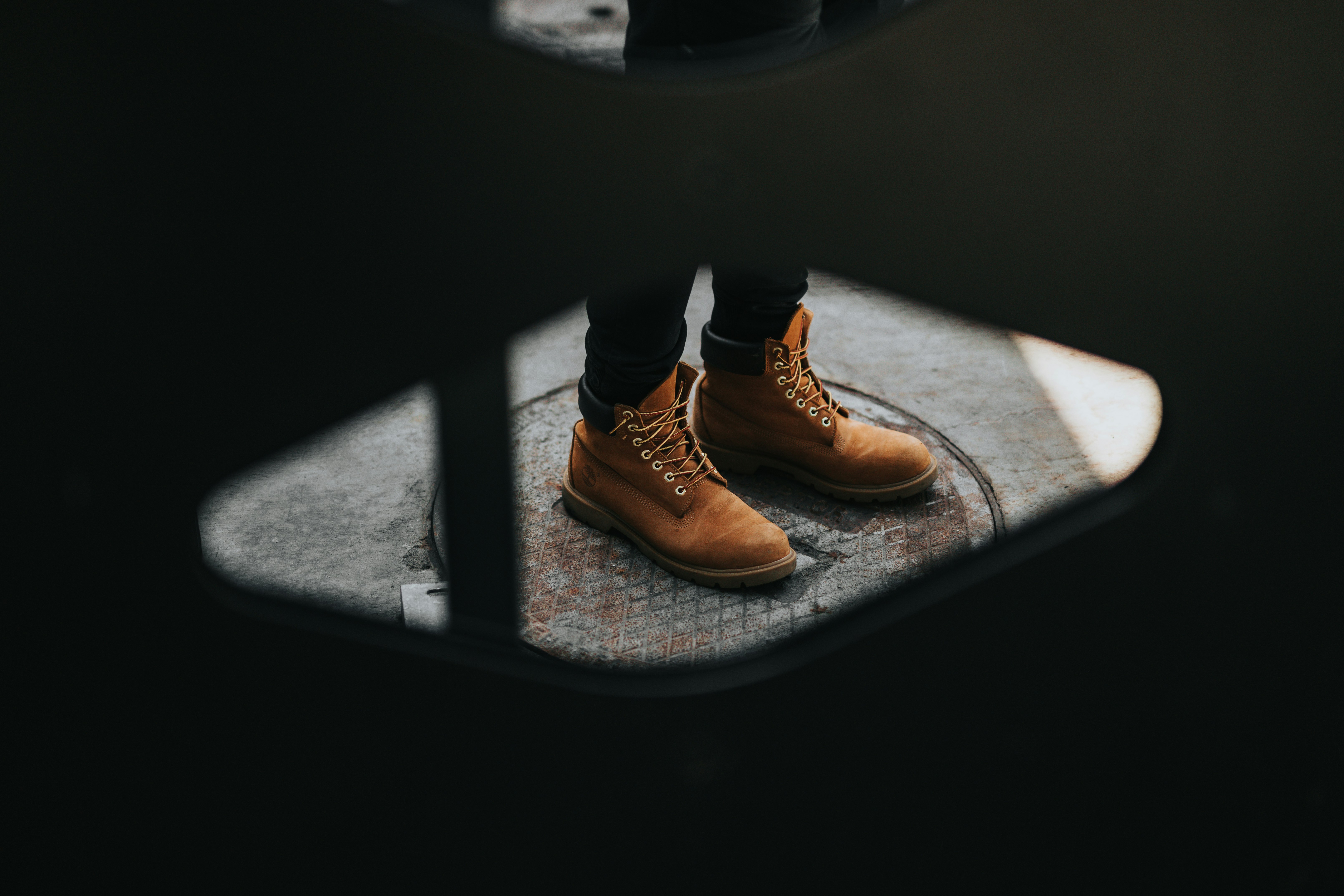 person wearing brown suede boots